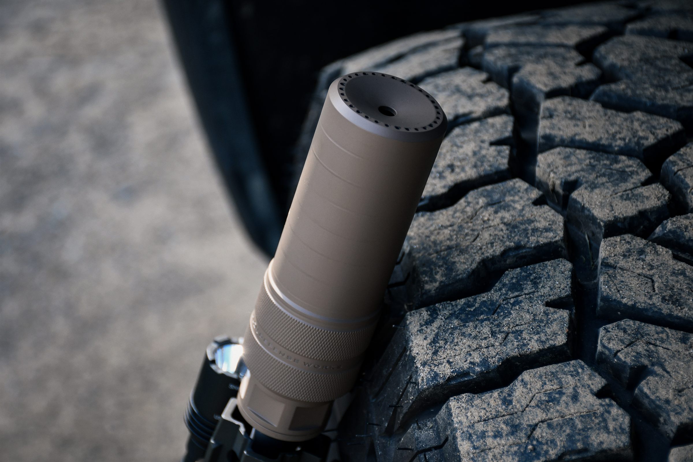 Diode 7.62 front cap resting on a truck tire