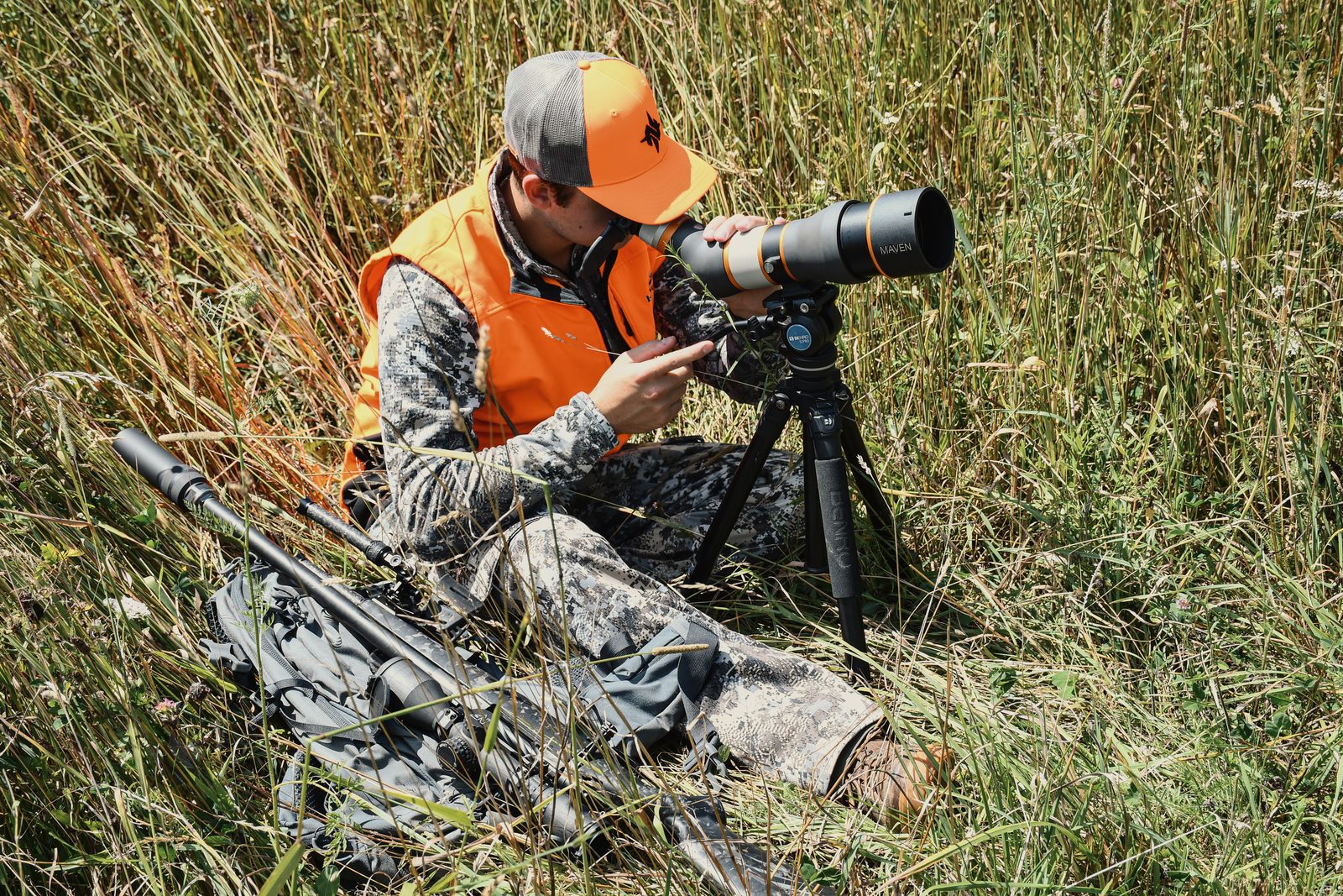 Hunter carrying a Peregrine-equipped rifle