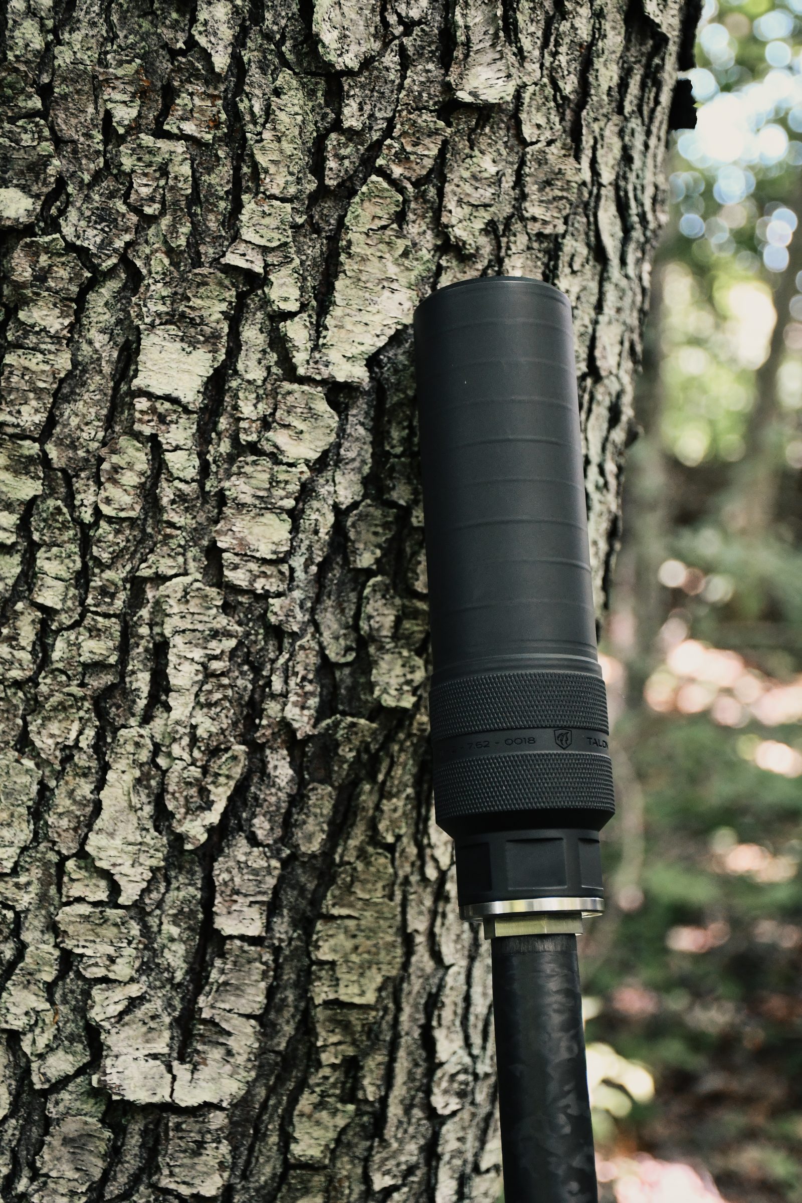 Peregrine prototype staged against a tree in the field