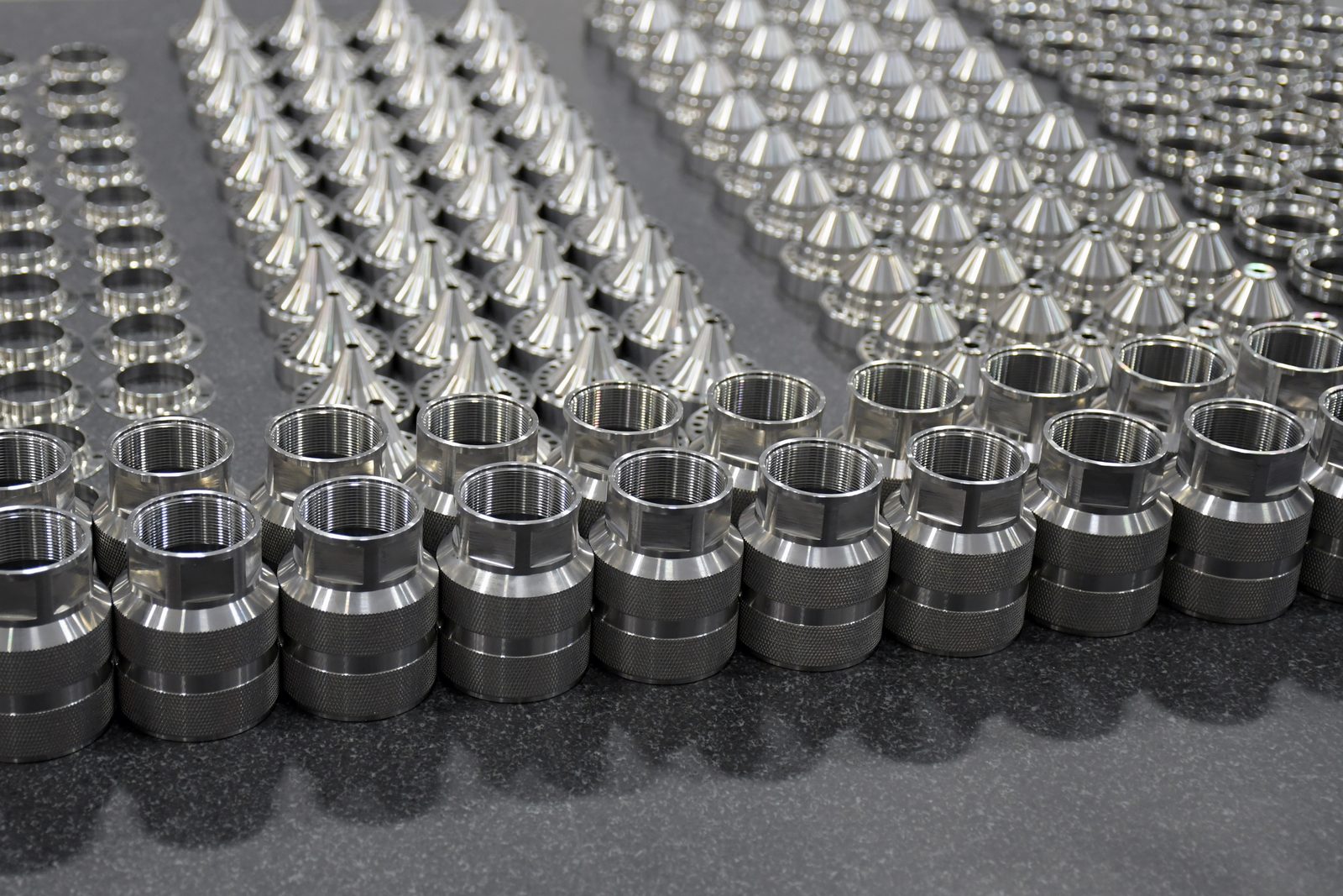 Welded segmented suppressor core clamped in a fixture on a granite surface plate
