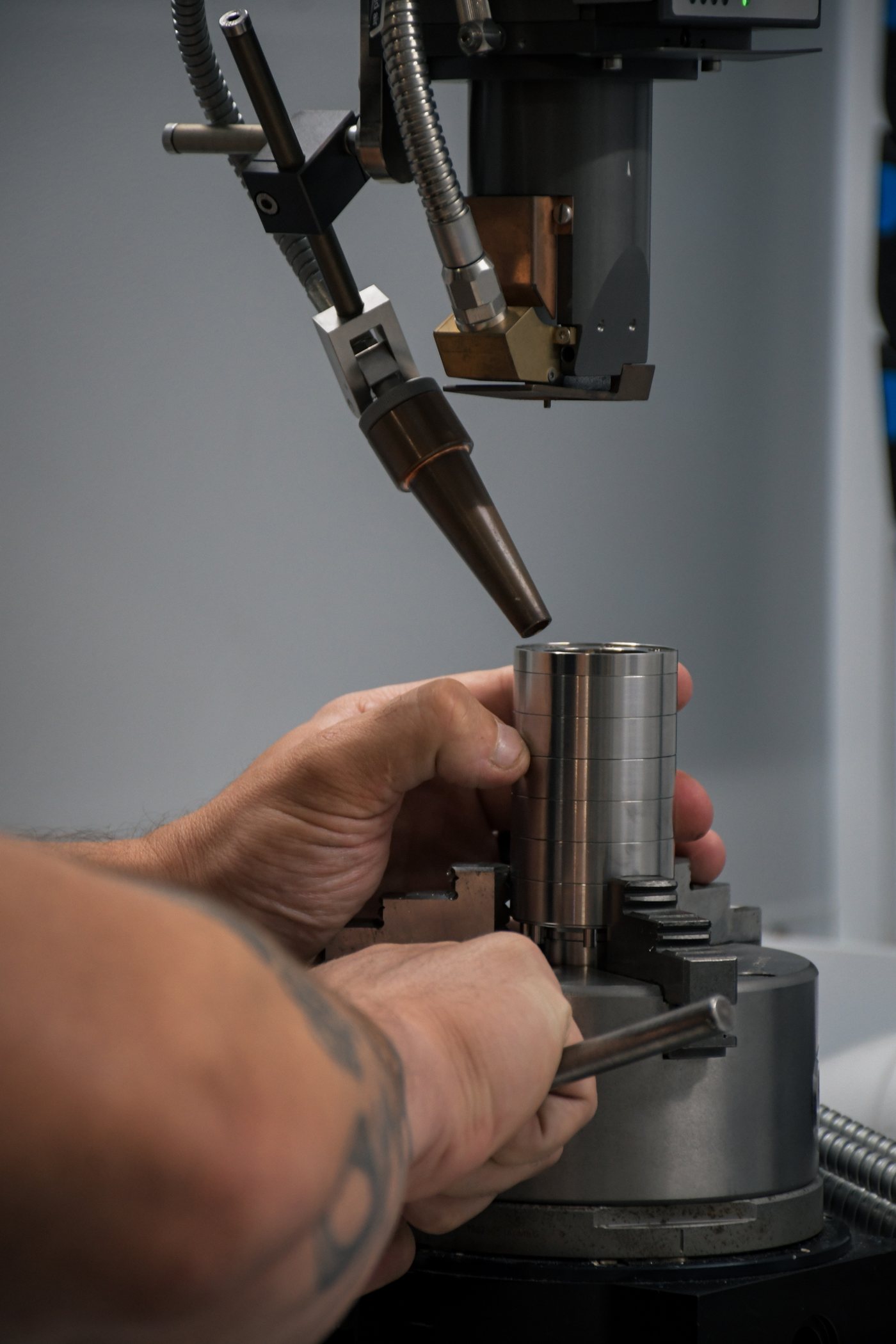 Laser weld arc live on a rotating suppressor tube in the weld cell